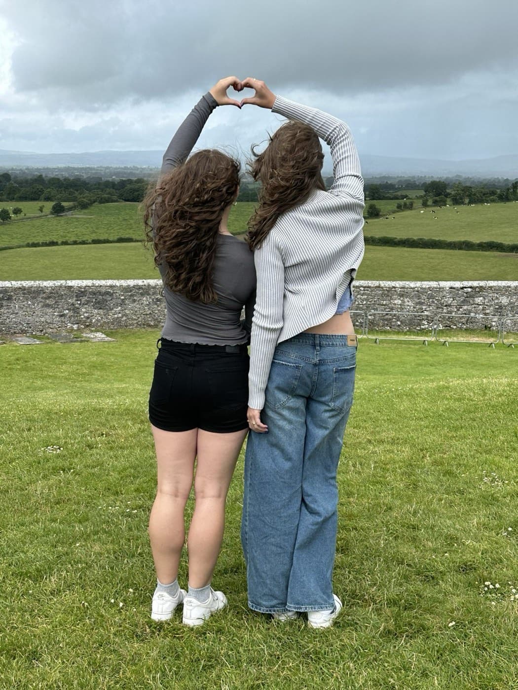 Mary and Darcy, heart hands, Rock of Cashel, 2024